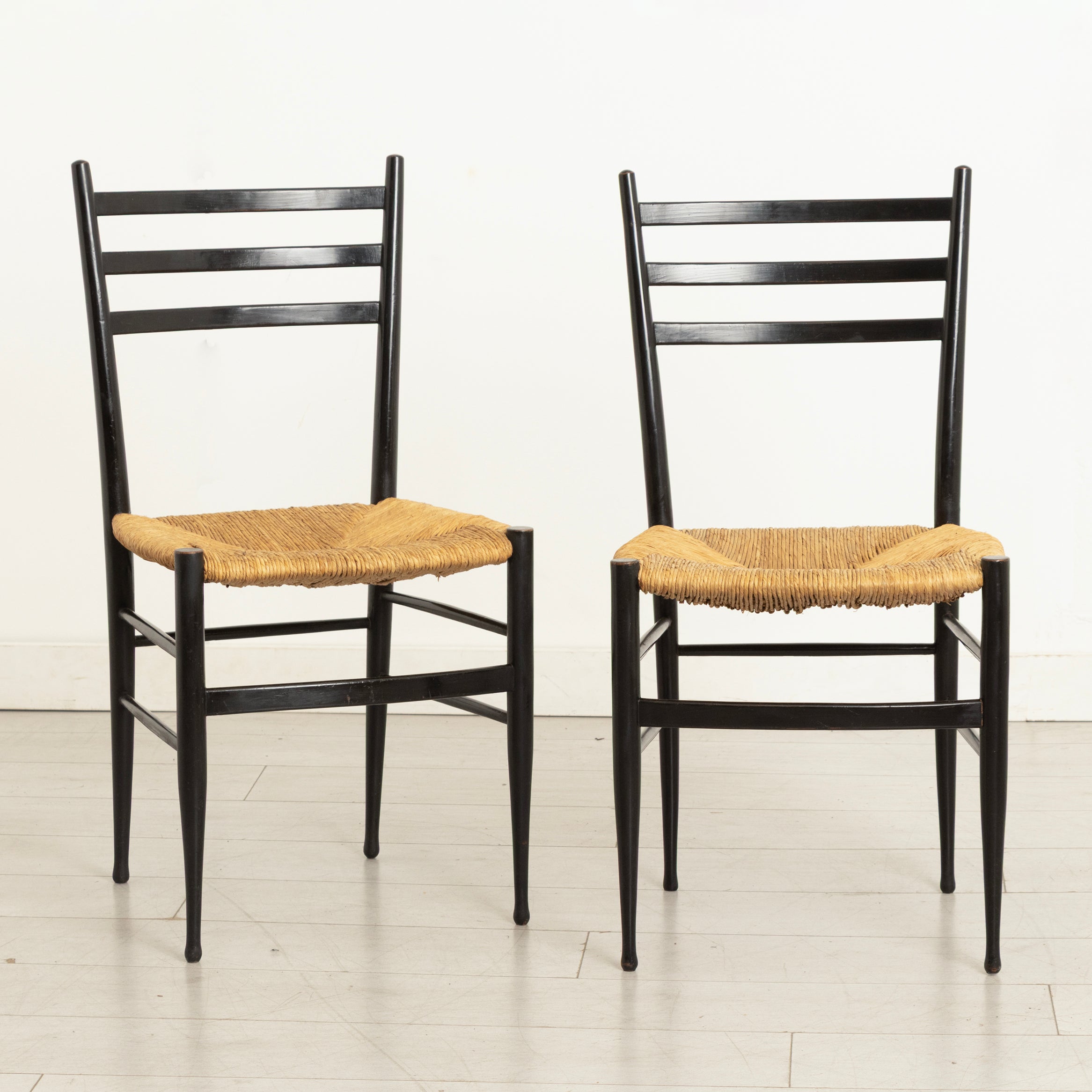 Pair of Midcentury Italian Ebonised Ladder-back Chairs with Rush Seats in the style of Gio Ponti c.1965