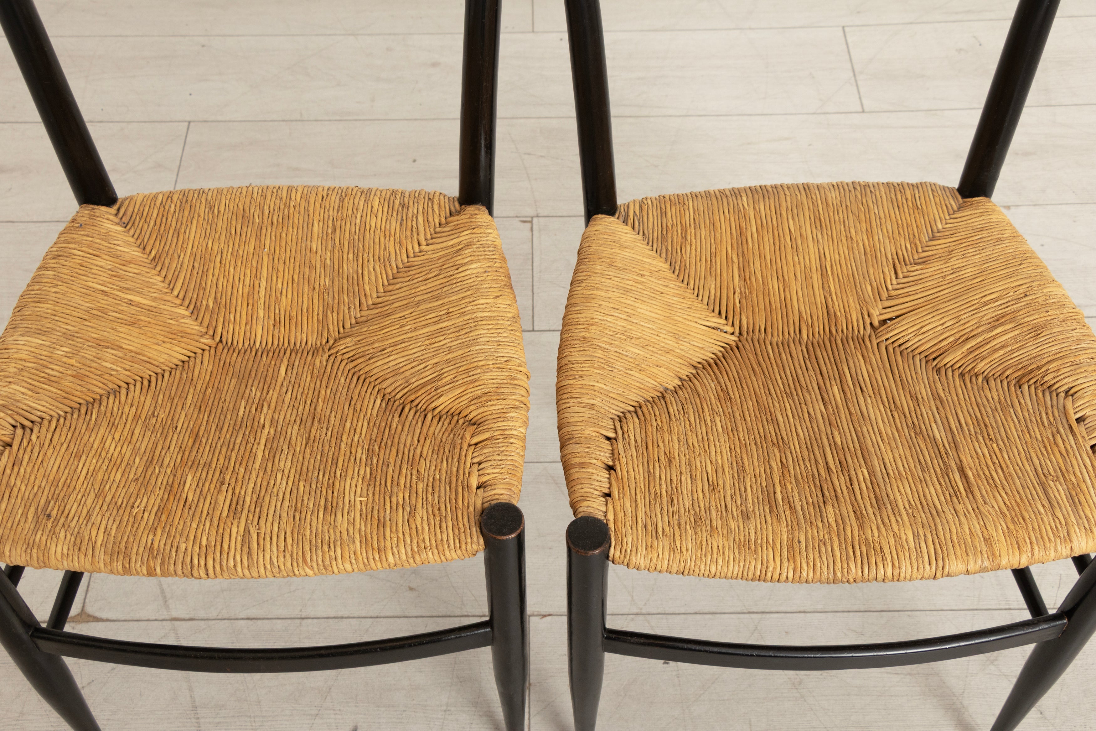 Pair of Midcentury Italian Ebonised Ladder-back Chairs with Rush Seats in the style of Gio Ponti c.1965
