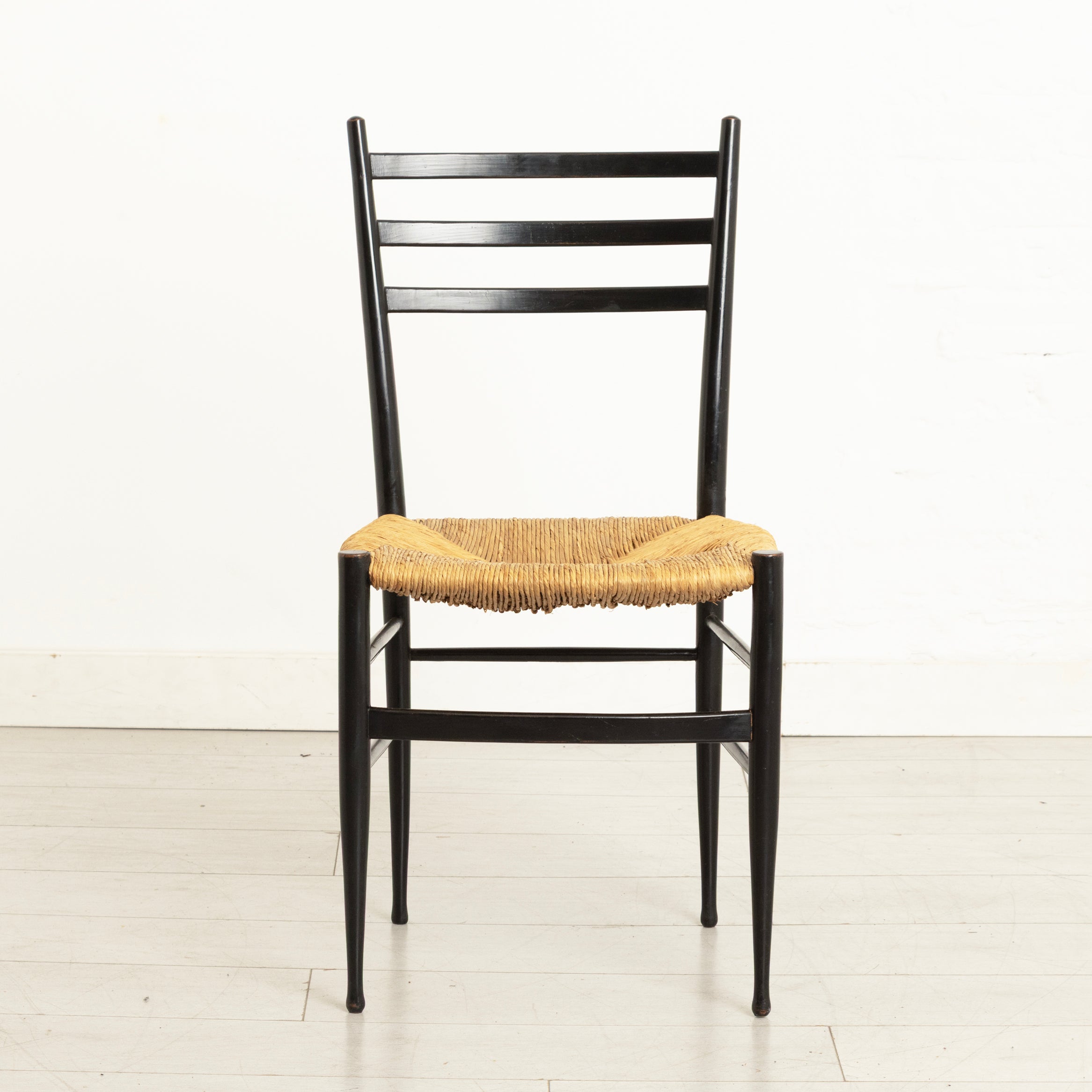 Pair of Midcentury Italian Ebonised Ladder-back Chairs with Rush Seats in the style of Gio Ponti c.1965