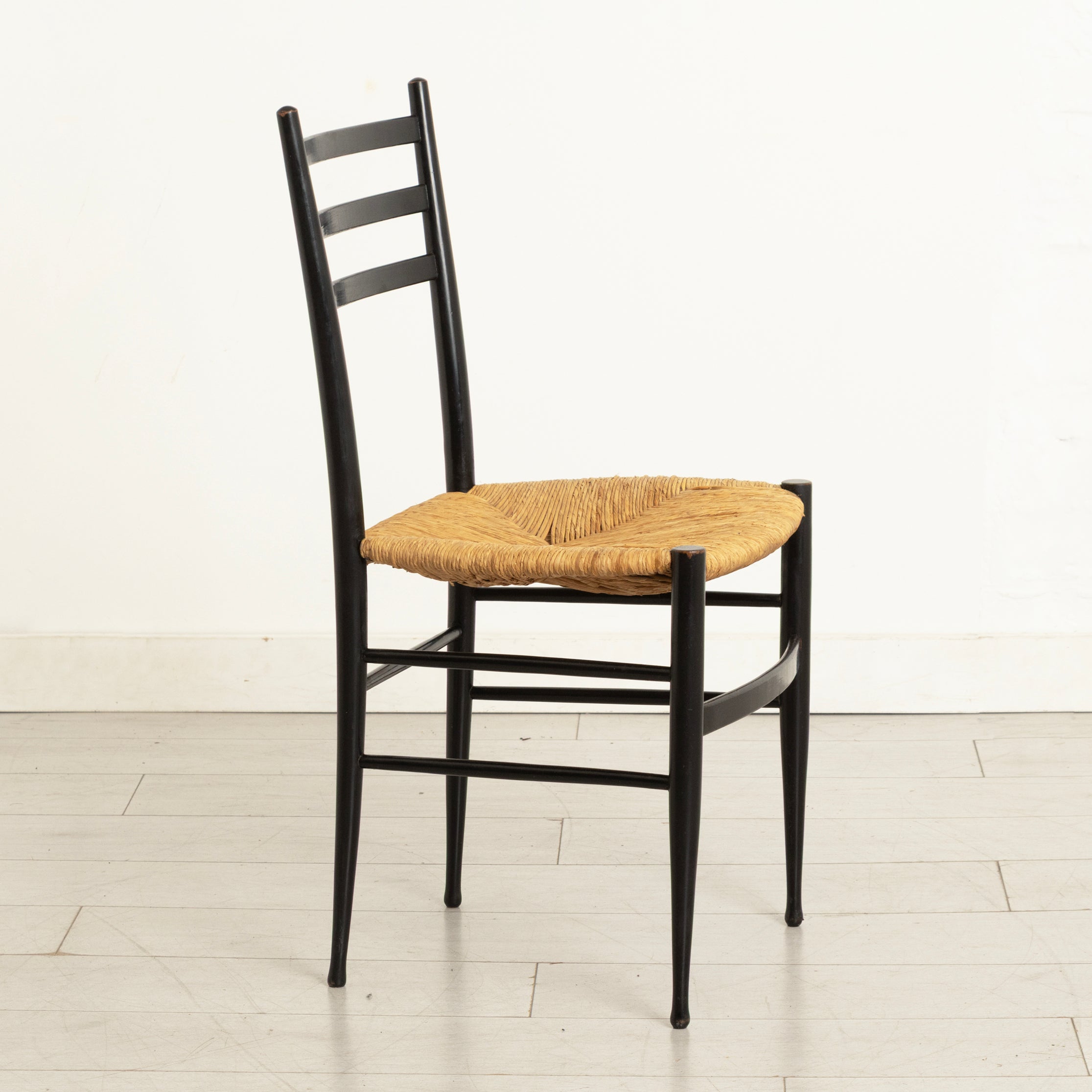 Pair of Midcentury Italian Ebonised Ladder-back Chairs with Rush Seats in the style of Gio Ponti c.1965