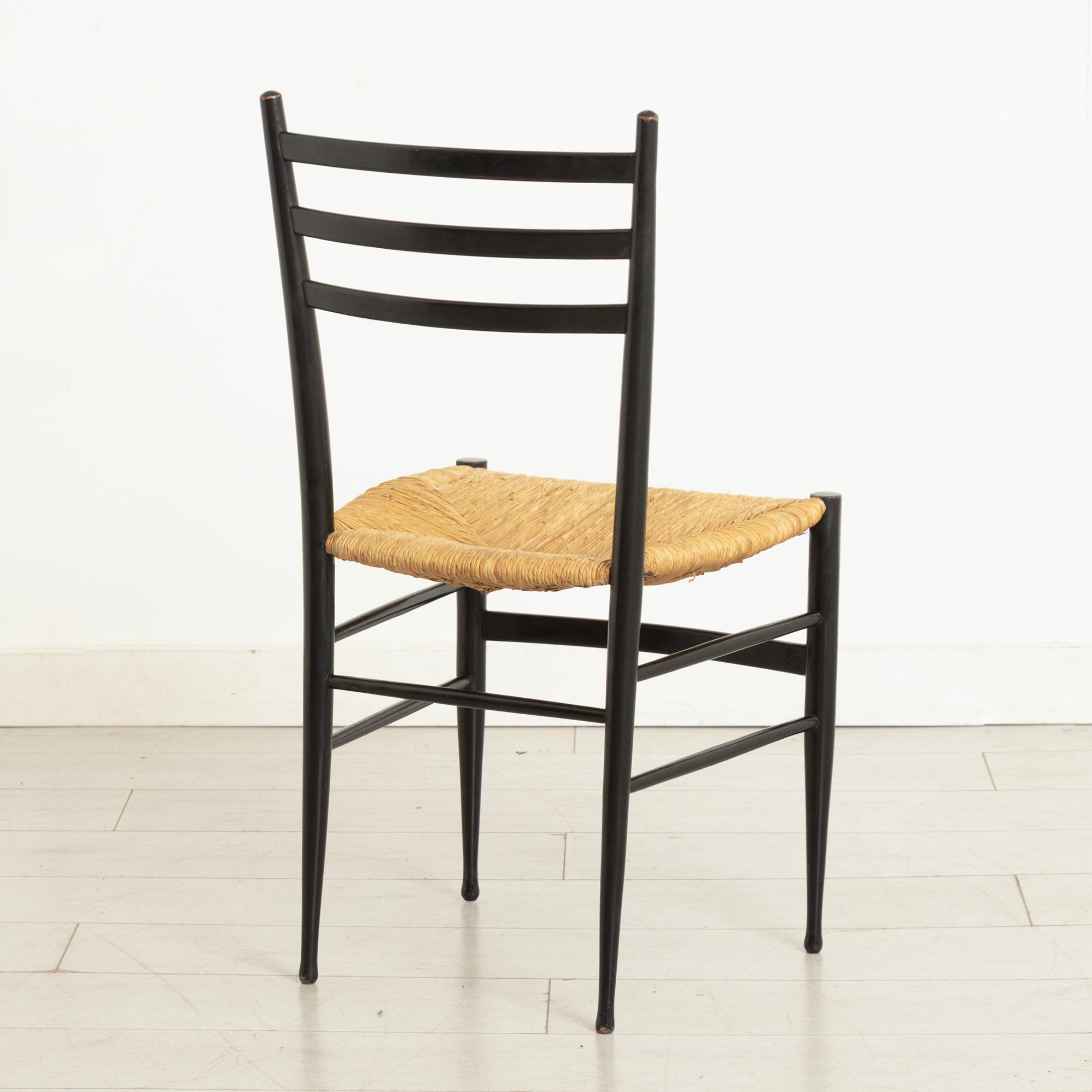 Pair of Midcentury Italian Ebonised Ladder-back Chairs with Rush Seats in the style of Gio Ponti c.1965